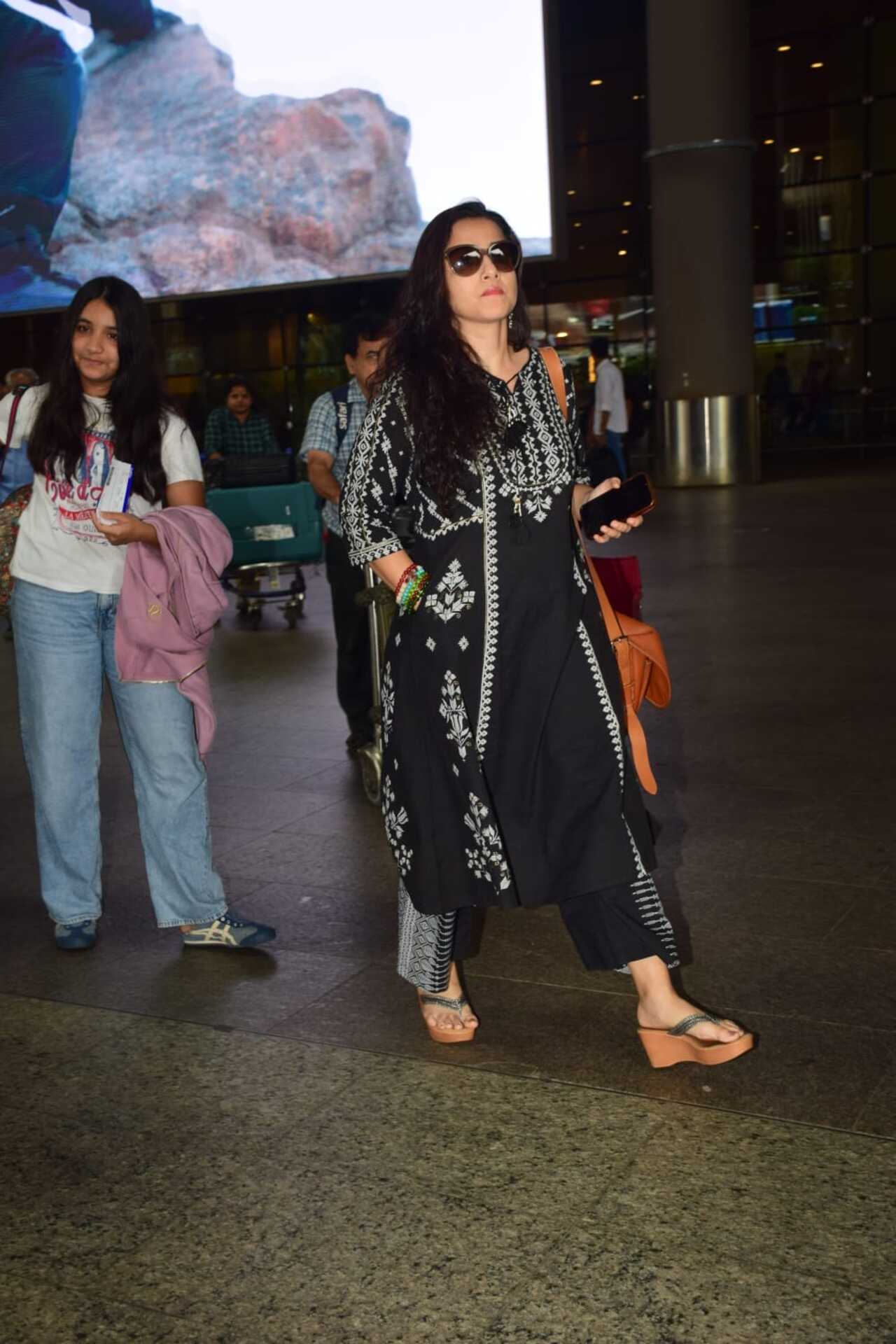 Vidya Balan spotted at the airport in a cheery mood